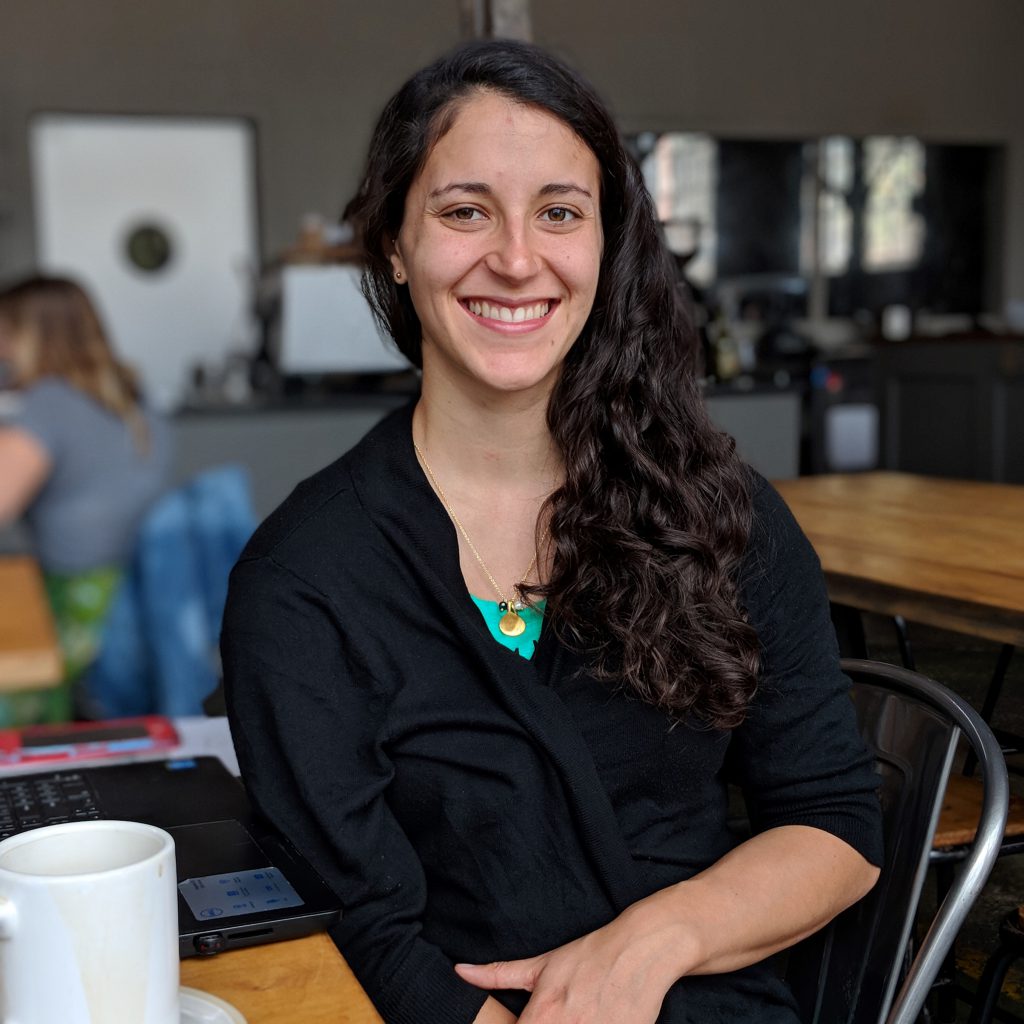 Elizabeth Moraff, copywriter and marketing strategist, smiling in a bright studio